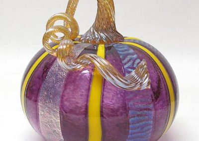 Purple and yellow Venetian style glass pumpkin by Ken and Ingrid Hanson